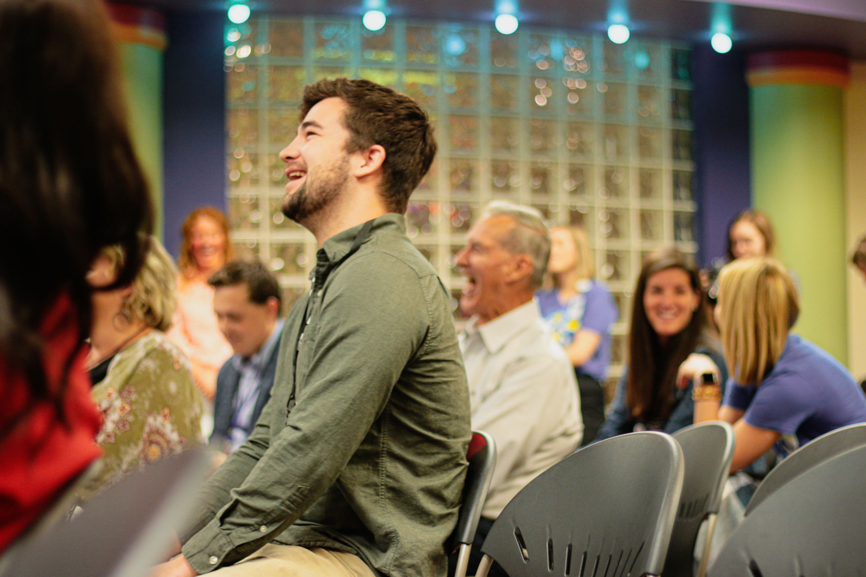 Josh McQuade laughs while sitting down at the Big Slick press conference in Kansas City, Missouri